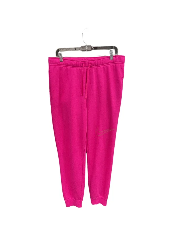 Athletic track pants for running training days -Athletic Pants By Nike Apparel In Pink, Size: L