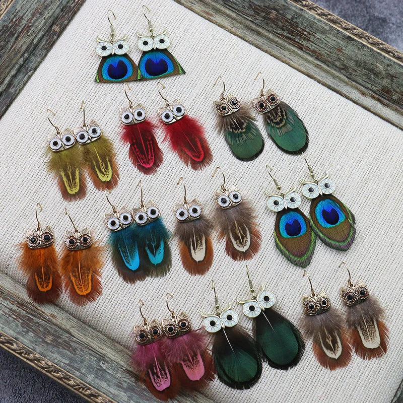 Best hoop earrings with matching bracelets for a coordinated jewelry set-Hoop earrings in resin-Wholesale Bohemian Owl Feather Alloy Earrings